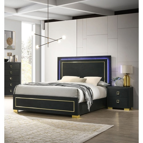 Modern bedroom with a black upholstered bed and matching nightstand.