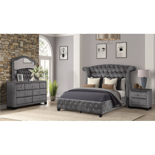 Gray bedroom set with bed, dresser, mirror, and nightstands in a room with stone wall and window.