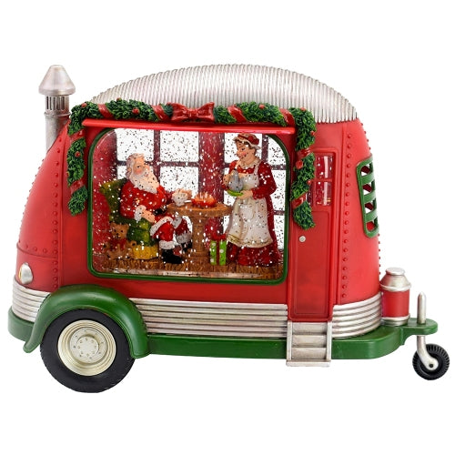 Decorative Christmas camper with Santa Claus and Mrs. Claus inside 