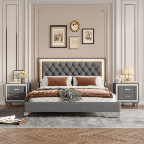 Modern bedroom with a gray upholstered bed, nightstands, and decorative elements.