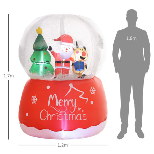 Inflatable Christmas snow globe with Santa Claus, reindeer, and tree, shown with a person for scale.